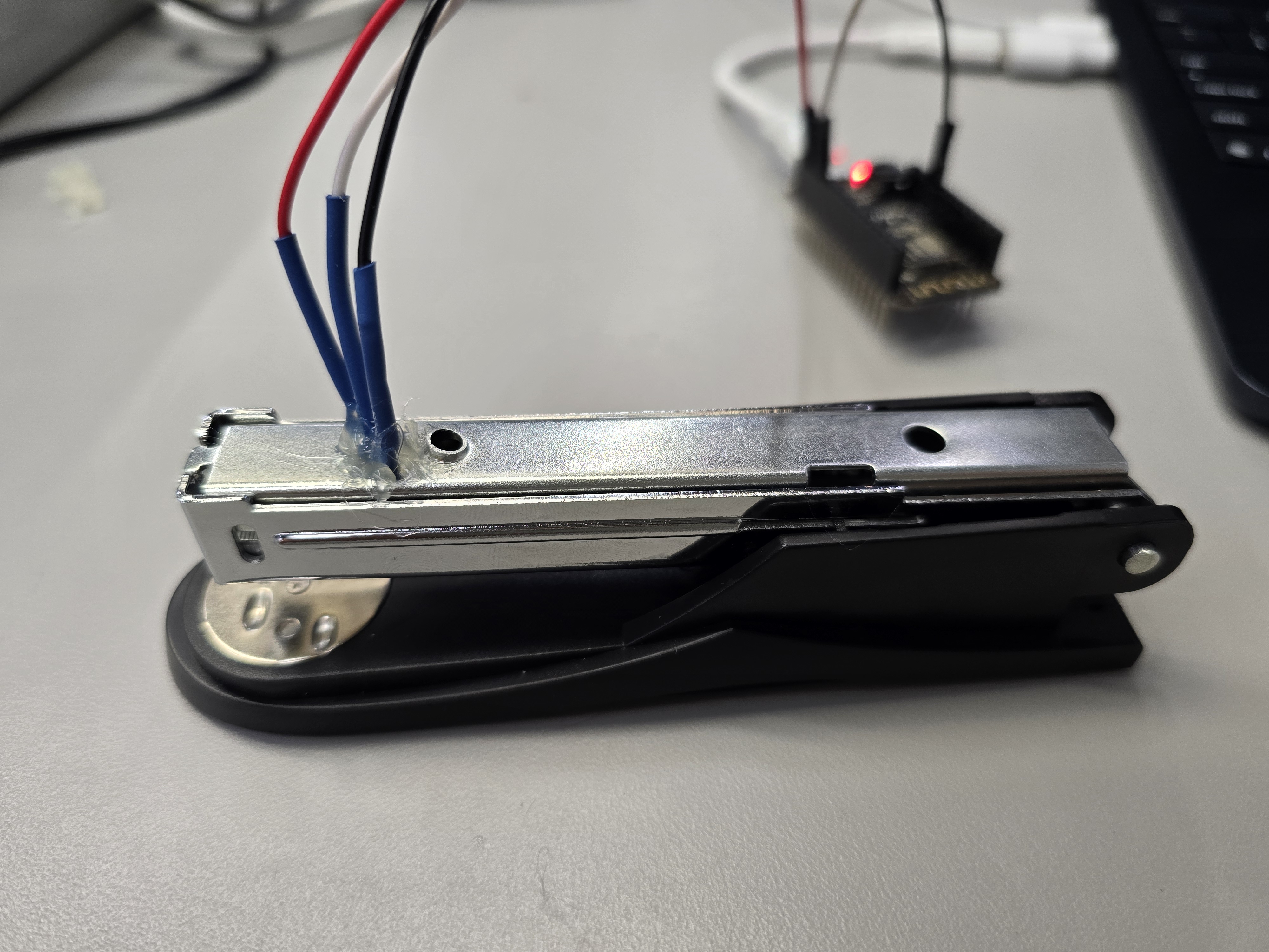 Stapler rail with heat-shrunk leads during test